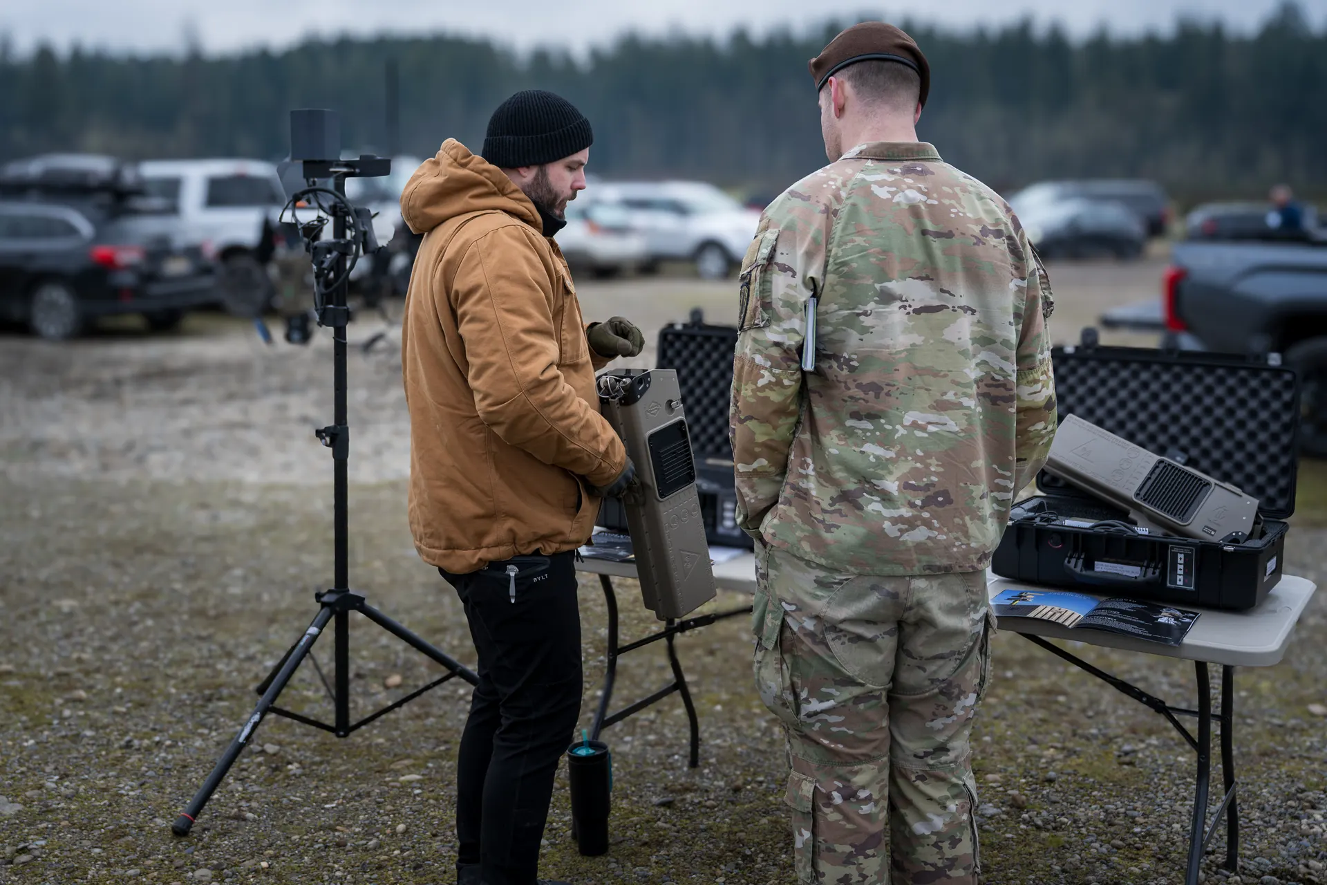 Founder handing equipment to U.S. Army soldier during Warfighter Ready field demonstration